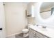 This bathroom features white fixtures, a vanity with sink, an oval mirror, and a shower with curtain at 137 Salem Creek Dr, Goose Creek, SC 29445