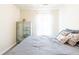 A comfortable bedroom features a large bed, decorative pillows, and a dresser near the window at 137 Salem Creek Dr, Goose Creek, SC 29445