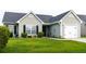 Charming single-story home showcasing manicured landscaping, a one car garage, and a walkway to the front door at 137 Salem Creek Dr, Goose Creek, SC 29445