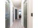 The hallway features modern gray wood-look floors, neutral walls, and gray doors at 137 Salem Creek Dr, Goose Creek, SC 29445