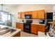 Charming kitchen with oak cabinets, sleek black appliances, and great natural lighting at 137 Salem Creek Dr, Goose Creek, SC 29445