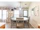 Eat-in kitchen featuring a round table with seating for four and rustic brick accent wall at 137 Salem Creek Dr, Goose Creek, SC 29445