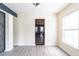 Open-concept living room with a view of the kitchen through decorative doorway at 137 Salem Creek Dr, Goose Creek, SC 29445