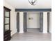 Bright living room featuring gray wood flooring and decorative beam architectural details at 137 Salem Creek Dr, Goose Creek, SC 29445