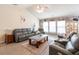 Open-concept living area boasts a brick accent wall, ceiling fan and modern finishes at 137 Salem Creek Dr, Goose Creek, SC 29445