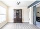 Bright living room featuring gray wood flooring, natural light, and dark wood furniture at 137 Salem Creek Dr, Goose Creek, SC 29445