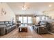 Spacious living room with brick accent wall, ceiling fan, and updated furnishings at 137 Salem Creek Dr, Goose Creek, SC 29445