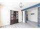 Open floor plan with wood-look floors, dark wood beam, and a decorative cabinet at 137 Salem Creek Dr, Goose Creek, SC 29445
