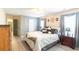 Comfortable main bedroom featuring wood floors, neutral walls, and a well-lit space with two windows at 137 Salem Creek Dr, Goose Creek, SC 29445