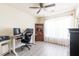 Bright home office featuring a ceiling fan, large window, and desk with dual monitors at 137 Salem Creek Dr, Goose Creek, SC 29445