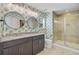 Stylish bathroom featuring dual sinks, a modern shower, and a toilet at 142 Elliott Creek Ln, Summerville, SC 29485