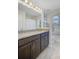 Bathroom featuring a granite vanity top, modern lighting, and a window for natural light at 142 Elliott Creek Ln, Summerville, SC 29485
