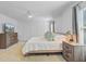 Spacious bedroom featuring a ceiling fan, television, bedside tables, and panel molding at 142 Elliott Creek Ln, Summerville, SC 29485