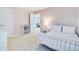 Bedroom featuring a white metal bed frame and a view into the adjacent living room at 142 Elliott Creek Ln, Summerville, SC 29485