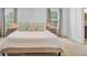 Bedroom featuring two windows, two bedside tables, a king bed, and panel molding at 142 Elliott Creek Ln, Summerville, SC 29485