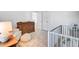 Bedroom featuring a crib, dresser, and comfortable seating area, offering functionality and style at 142 Elliott Creek Ln, Summerville, SC 29485