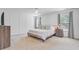 Bright, airy bedroom with panel molding, neutral walls, a ceiling fan, and two large windows at 142 Elliott Creek Ln, Summerville, SC 29485