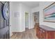 Welcoming entryway featuring hardwood floors, neutral paint, and tasteful decor, setting a warm tone at 142 Elliott Creek Ln, Summerville, SC 29485