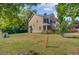 Charming two-story house with a spacious front yard, enhanced by beautiful trees and a well-maintained lawn at 142 Elliott Creek Ln, Summerville, SC 29485