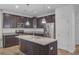 Stylish kitchen featuring granite countertops, stainless steel appliances, and dark cabinets at 142 Elliott Creek Ln, Summerville, SC 29485