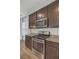 Well-equipped kitchen with stainless steel appliances, granite counters, and dark cabinetry at 142 Elliott Creek Ln, Summerville, SC 29485
