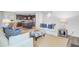 Open-concept living area with a fireplace, comfortable sofa, and seamless transition to the kitchen at 142 Elliott Creek Ln, Summerville, SC 29485
