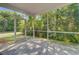 Inviting screened porch with a view of lush greenery, perfect for outdoor relaxation at 142 Elliott Creek Ln, Summerville, SC 29485