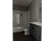 Bathroom showcasing a bathtub-shower combo, toilet, and gray vanity with white sink at 1420 Rehoboth Rd, Cottageville, SC 29435