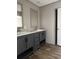 Bathroom featuring double vanities with gray cabinets and matching framed mirrors at 1420 Rehoboth Rd, Cottageville, SC 29435