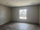 Bedroom featuring hardwood floors, a window that brings in natural light, and neutral wall color that offer modern comfort at 1420 Rehoboth Rd, Cottageville, SC 29435