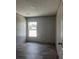 Bright bedroom with sleek floors, light walls, and natural light at 1420 Rehoboth Rd, Cottageville, SC 29435