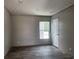 Well-lit bedroom with hardwood floors, neutral walls, and ample natural light that offer modern comfort and style at 1420 Rehoboth Rd, Cottageville, SC 29435