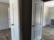 A view of the home's interior, showcasing the modern doors and wood-look floors at 1420 Rehoboth Rd, Cottageville, SC 29435