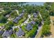 Aerial view of a beautiful neighborhood with mature trees and a scenic lake at 1441 Waterside Ct, Mount Pleasant, SC 29464