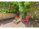 Cozy back patio with brick fire pit and two Adirondack chairs at 1441 Waterside Ct, Mount Pleasant, SC 29464