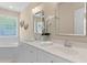 Bright bathroom with double sink vanity, modern fixtures, and jacuzzi near a window at 1441 Waterside Ct, Mount Pleasant, SC 29464