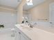 Bright bathroom with white cabinets, neutral walls, and modern lighting at 1441 Waterside Ct, Mount Pleasant, SC 29464