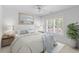 Bright bedroom with white furnishings, ceiling fan, and a shuttered window at 1441 Waterside Ct, Mount Pleasant, SC 29464
