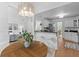 Dining area featuring hardwood floors and open layout to living room and kitchen at 1441 Waterside Ct, Mount Pleasant, SC 29464