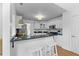 Bright kitchen with breakfast bar, granite countertops, white cabinets, and stainless appliances at 1441 Waterside Ct, Mount Pleasant, SC 29464