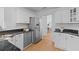 Eat-in kitchen featuring stainless steel appliances, white cabinets, and granite countertops at 1441 Waterside Ct, Mount Pleasant, SC 29464