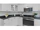 Well-lit kitchen features granite countertops, stainless appliances, and subway tile backsplash at 1441 Waterside Ct, Mount Pleasant, SC 29464