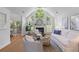 Bright living room featuring vaulted ceilings, a fireplace, hardwood floors, and stylish neutral decor at 1441 Waterside Ct, Mount Pleasant, SC 29464