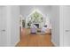 Bright living room featuring vaulted ceilings, a fireplace, hardwood floors, and stylish neutral decor at 1441 Waterside Ct, Mount Pleasant, SC 29464