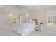 Bright main bedroom with tray ceiling, and a beautifully decorated sitting area at 1441 Waterside Ct, Mount Pleasant, SC 29464