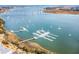 Scenic aerial view of a boat marina with yachts docked near the waterfront condos and beautiful views of the water and bridge at 145 Pier View St # 111, Charleston, SC 29492