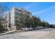 Brick apartment building featuring balconies and lush landscaping at 145 Pier View St # 111, Charleston, SC 29492
