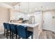 Eat-in kitchen features white cabinetry, granite countertops, and stainless steel appliances at 145 Pier View St # 111, Charleston, SC 29492