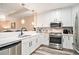 Bright kitchen with stainless appliances, a microwave, and overhead lighting at 145 Pier View St # 111, Charleston, SC 29492