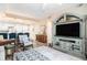View of the living room with open kitchen and breakfast bar seating at 145 Pier View St # 111, Charleston, SC 29492